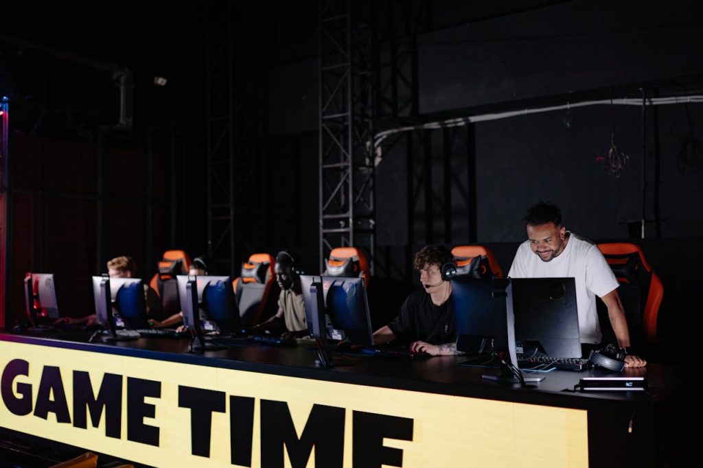 How Card Game Strategies Work in Popular Games Like Poker and Uno Esports team engaged in competitive gaming session indoors, showcasing teamwork and concentration.