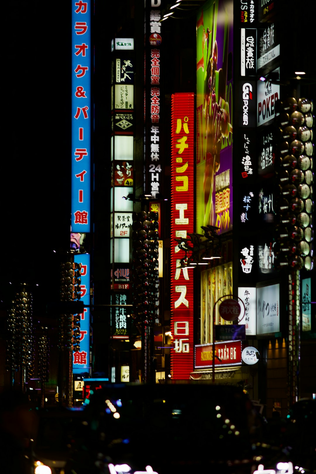 bright-neon-signs-illuminate-a-city-street-at-night-ak1awtibdg8