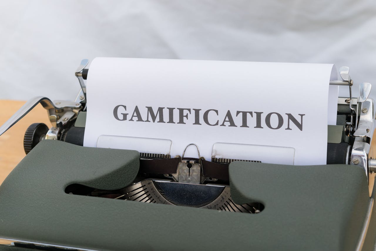 Offerings Close-up of a vintage typewriter displaying the word Gamification on paper.