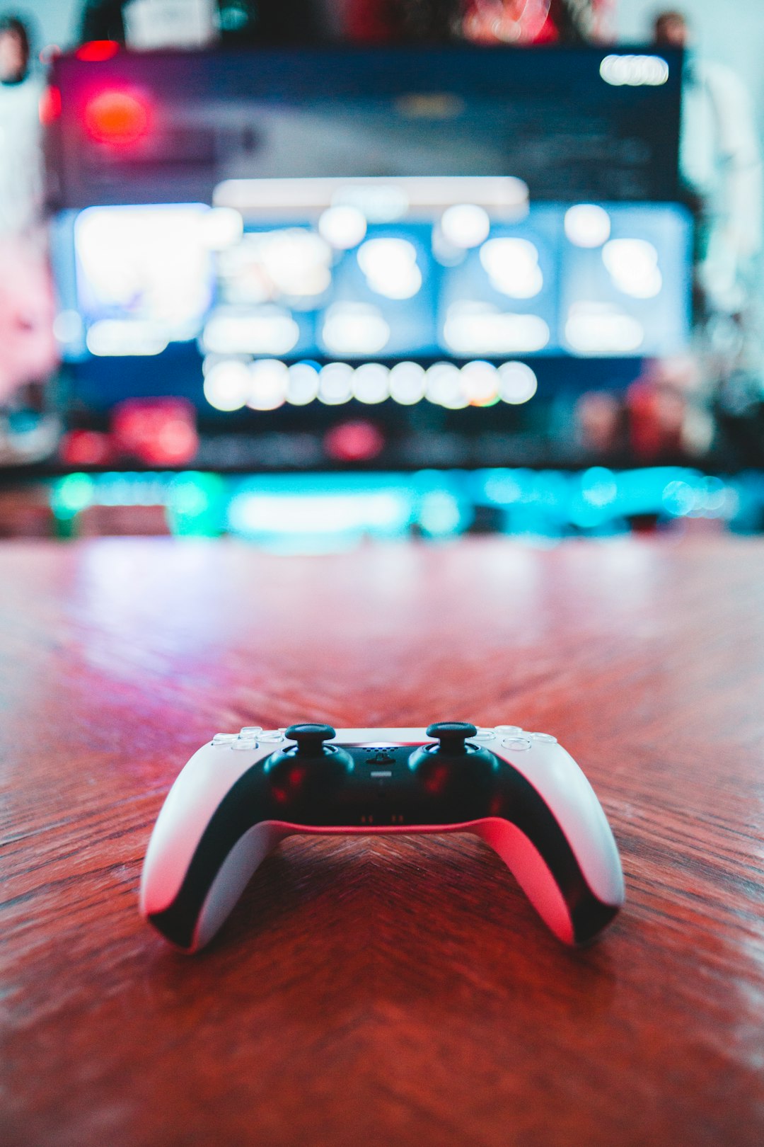 Offerings red-and-white-game-controller-on-brown-wooden-table-m5vk9nzsiba